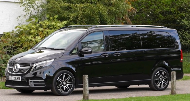 Airport concierge managing VIP services at Manchester Airport.